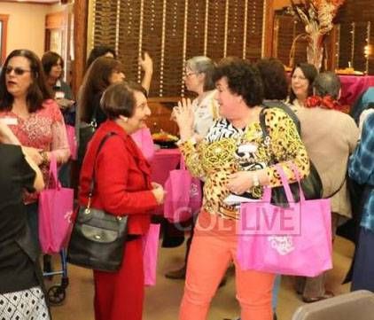 pink challah bag with lettering at a challah bake

