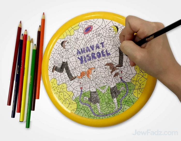 Hand coloring Ahavas Yisrael color-by-number frisbee with colored pencils – perfect for Lag Baomer and fair booths.